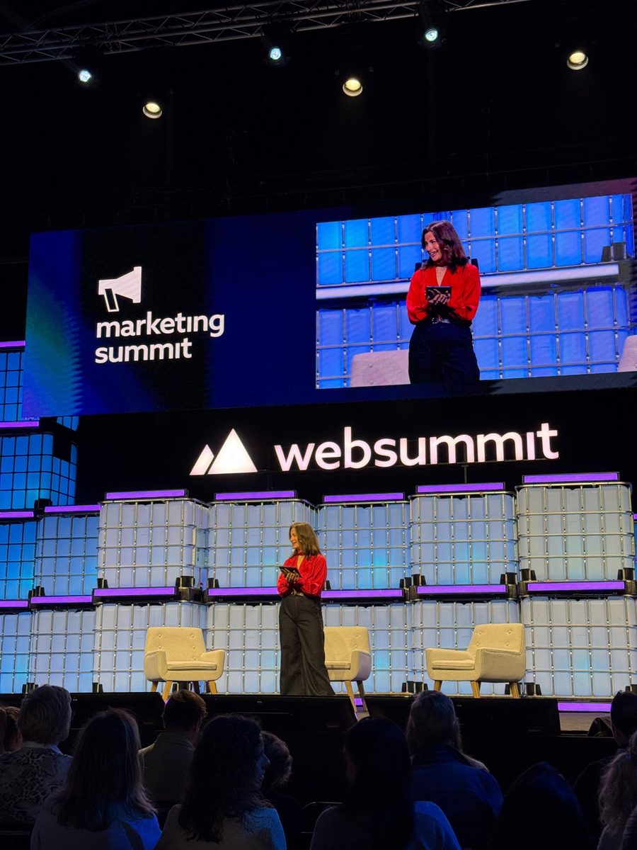 Milly on the Web Summit stage in front of a huge screen